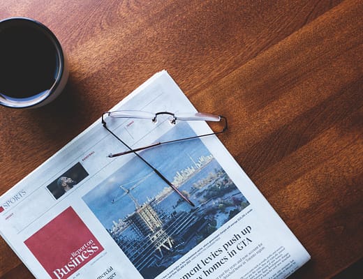business newspaper coffee time